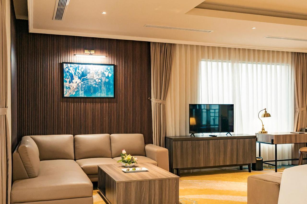 La Vela Hue Hotel Exterior photo A living room in a suite at the hotel